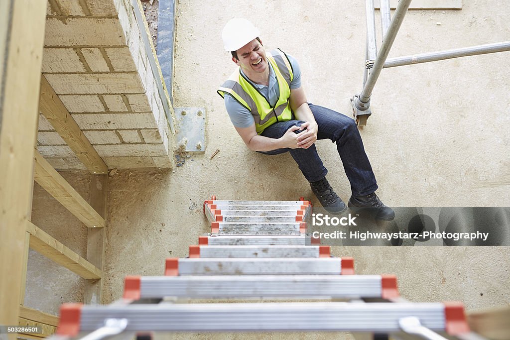 Construction Worker Falling Off Ladder And Injuring Leg Construction Worker Stock Photo