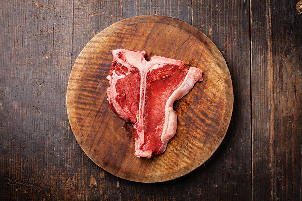 istock Raw meat T-Bone Steak on wooden background 503286963