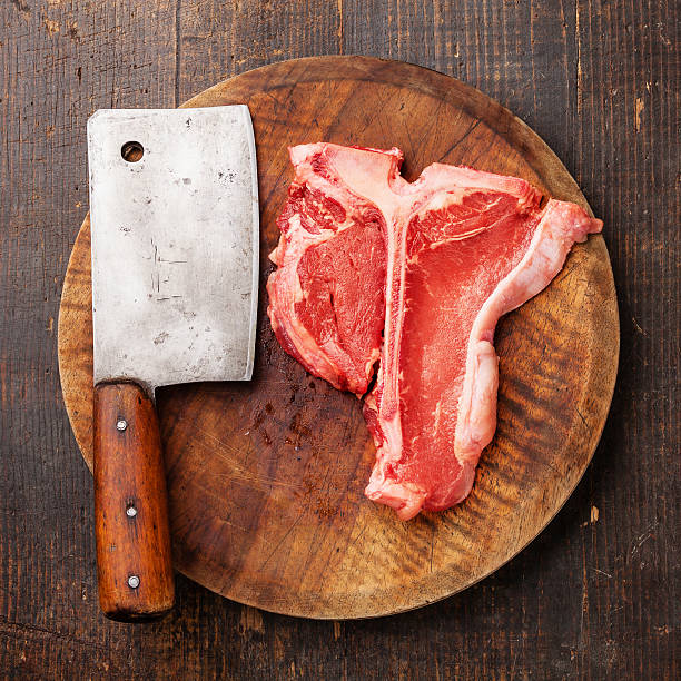 istock Raw meat T-Bone Steak and meat cleaver 503286965