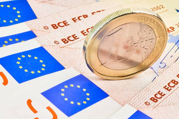 istock euro coin on 50-euro banknotes 503299018