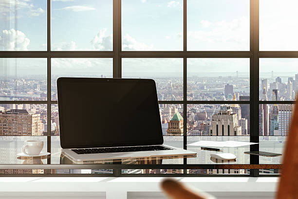 istock Blank laptop on a glass table in a modern office 503300016