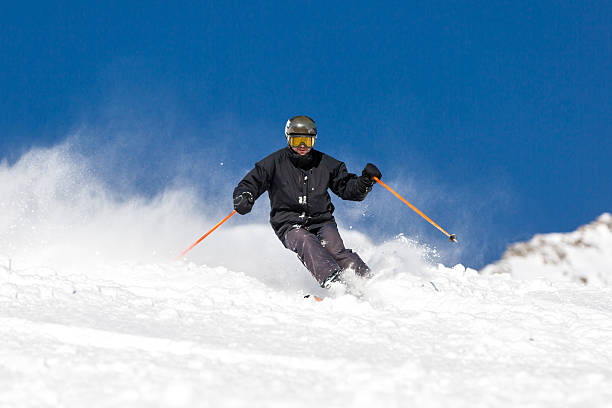 istock Skier skiing on ski slope 503303640
