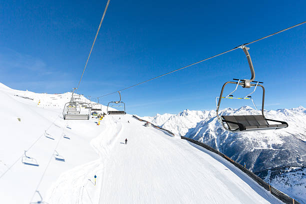 istock Chair lift and ski slope 503304032