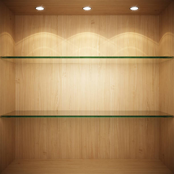 Empty wooden showcase with glass shelves