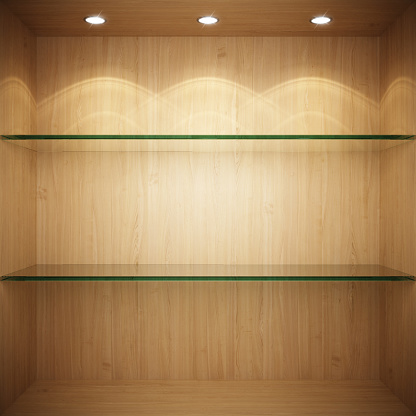 Empty wooden showcase with glass shelves for exhibition