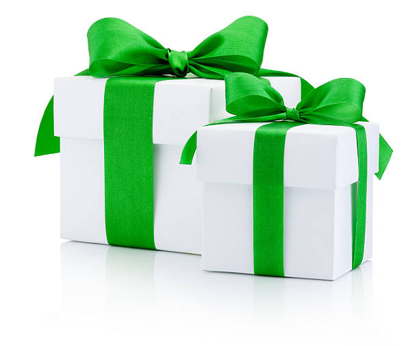 istock White gift boxes tied green ribbon Isolated on white background 503305652