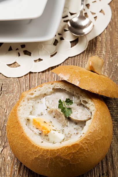 istock Traditional polish white borscht with eggs and sausage in bread 503308456