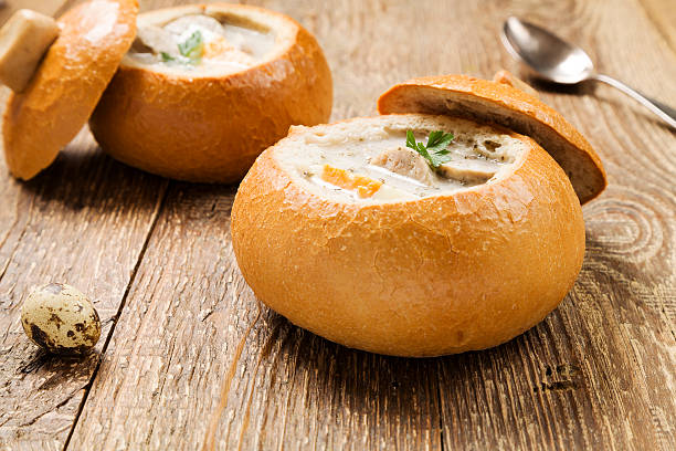 istock Traditional polish white borscht with eggs and sausage in bread 503308494