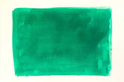 green watercolor painting background on white paper