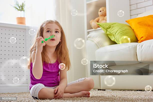 Happy Child Stock Photo - Download Image Now - Blowing, Bubble, Bubble Wand