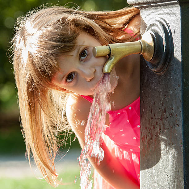 Little girl drinking water