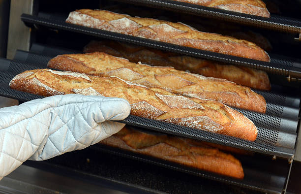 istock Baker taking a loaf of freshly baked bread 503311423