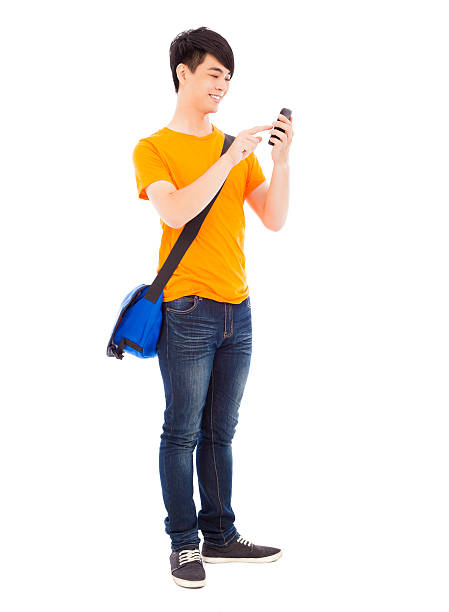 istock young student touching a smart phone with white background 503311485