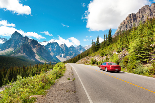 Tourist traveling in a car vacationing in the Canadian Rockies Banff National Park in Canada.