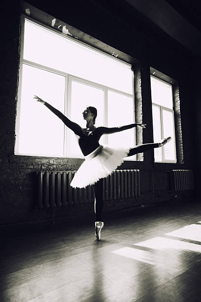 istock Ballerina dancing indoors 503312881