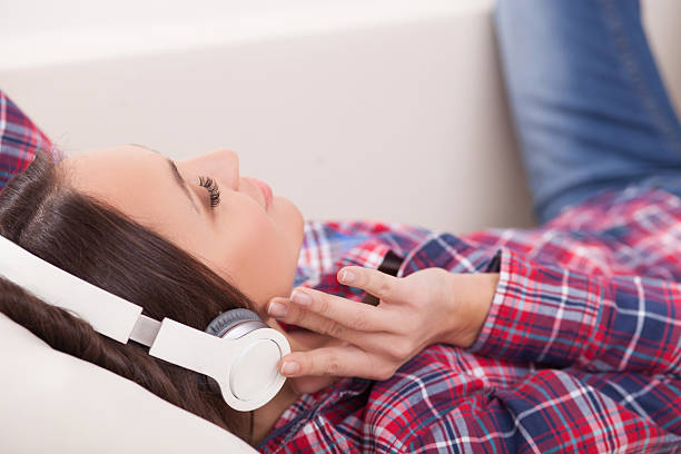 istock Pretty woman is entertaining herself with music 503314056
