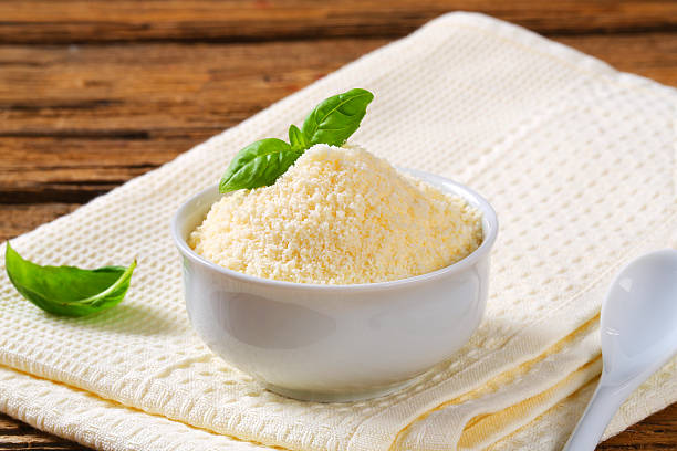 Grated parmesan in a porcelain bowl stock photo