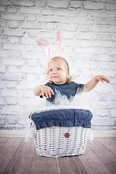 istock Cute baby bunny in the basket 503314155