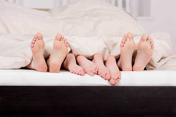 istock Close-up of a mature couple's feet on bed 503314449