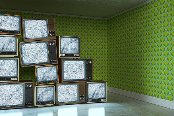 istock Stack of vintage old televisions showing static signal 503314483