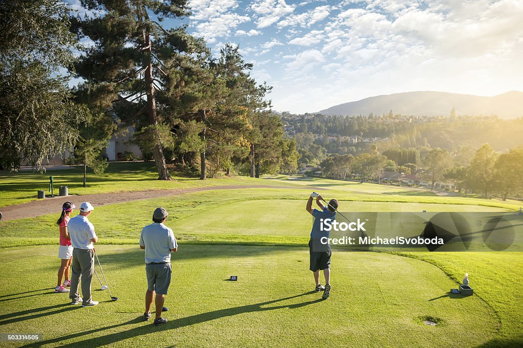 Groupe de quatre amis de golfeurs - Photo de Golf libre de droits
