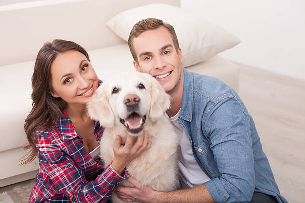istock Attractive young married couple with cute pet 503314602