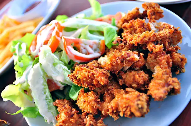 Photo of Crispy fried chicken,  herbs with Salad