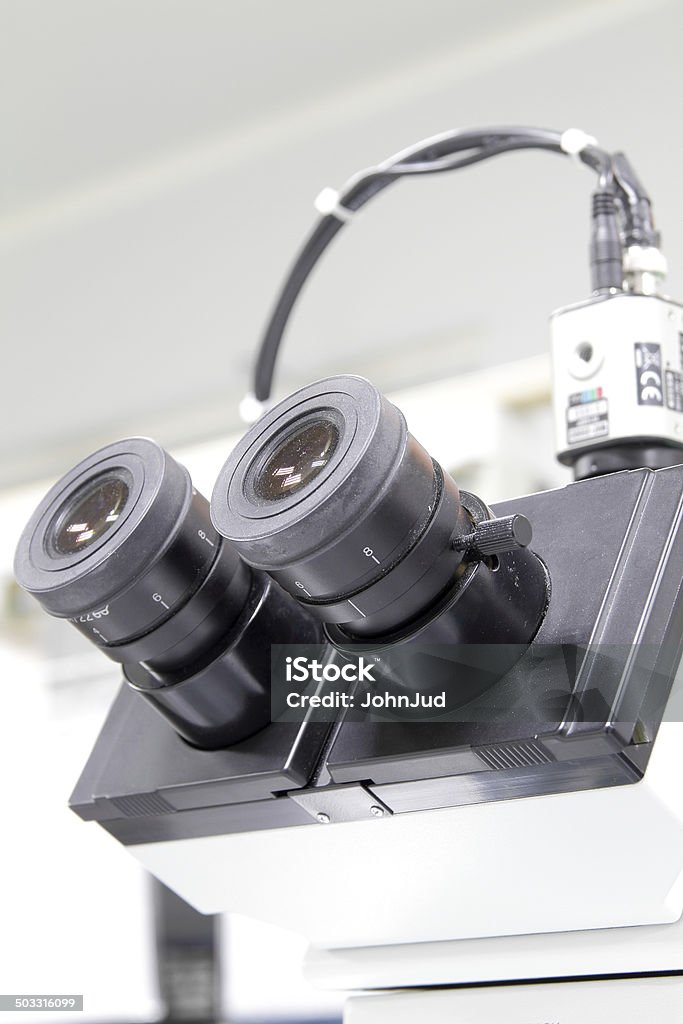 Microscope High power microscope with multiple lens in lab Biology Stock Photo