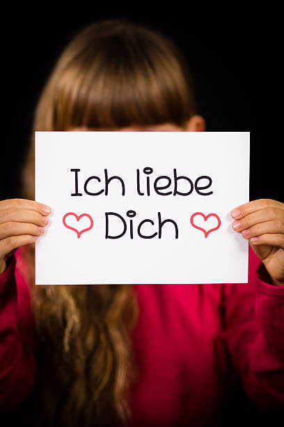 istock Child holding sign with German words Ich liebe Dich 503324506