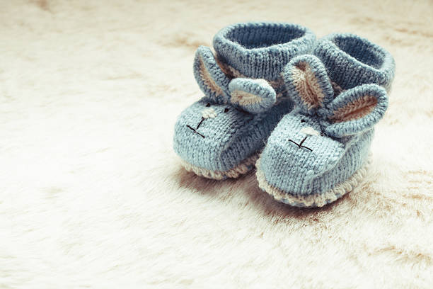 Knitted baby booties stock photo