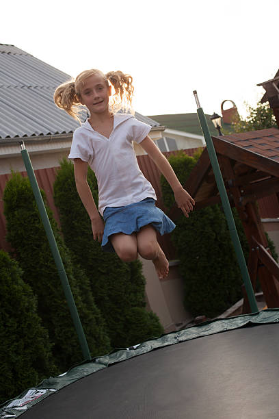 istock Girl is jumping on batut 503328512