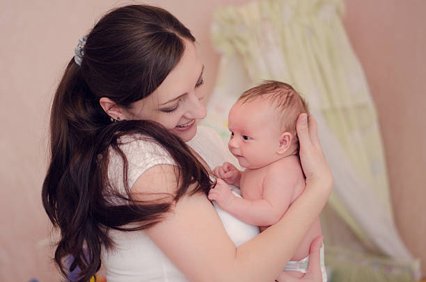 istock Mother holds her baby 503332816