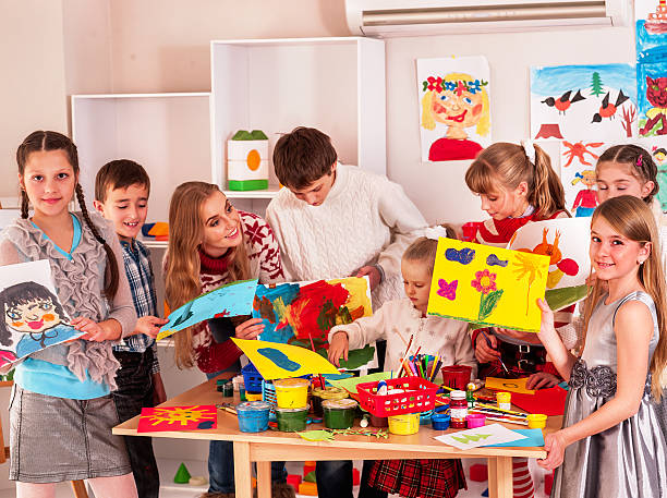 istock Child painting at art school 503333508