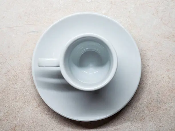 An empty espresso cup.