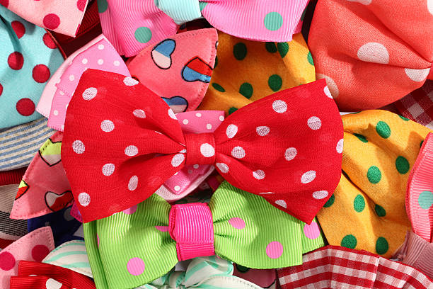 This is a pile of bow ties and hair bows.