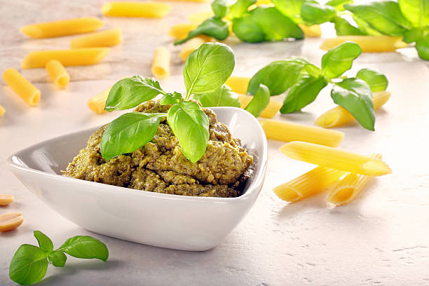 istock Green basil pesto in white bowl 503337582