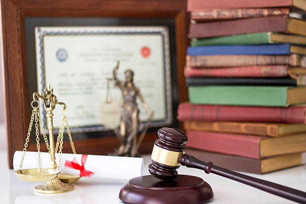 Law concept, statue, gavel, scale, books and diploma stock photo