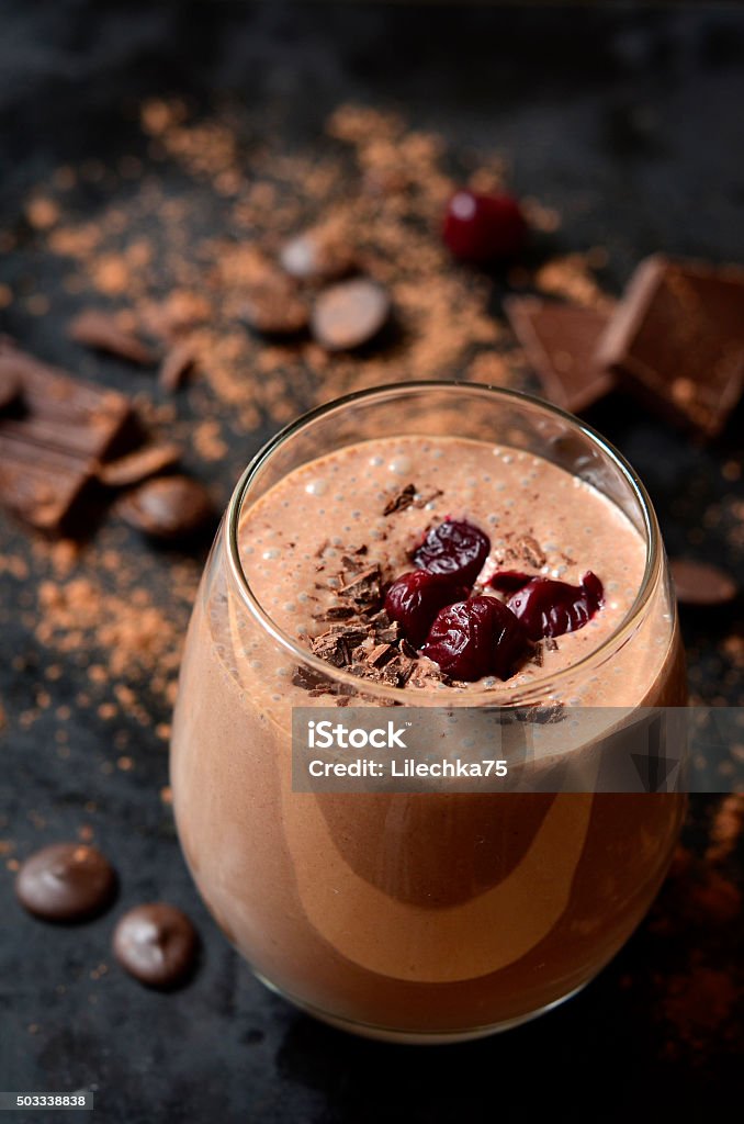 Delicious chocolate smoothie "Black forest". Delicious chocolate smoothie "Black forest" with cherry on dark table. Hot Chocolate Stock Photo