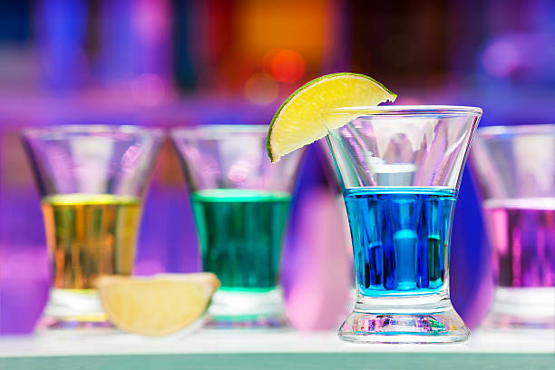 istock Several glasses with color drinks and lime in bar 503338858