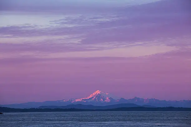 Sunset over Mt.Baker in Washington State as seen from Cattle Point in Victoria,BC.