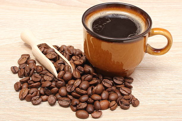 istock Coffee grains and cup of beverage 503341387