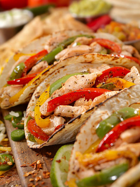 Chicken Fajitas Grilled Chicken Fajitas with Peppers - Photographed on Hasselblad H3D2-39mb Camera fajita photos stock pictures, royalty-free photos & images