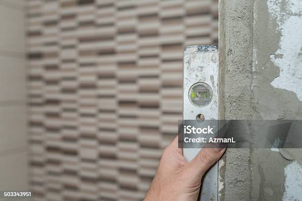 Checking Level Stock Photo - Download Image Now - DIY, Tile, Adult