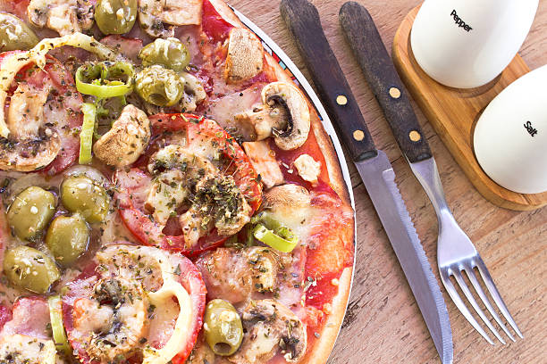 Delicious italian pizzas served on wooden table