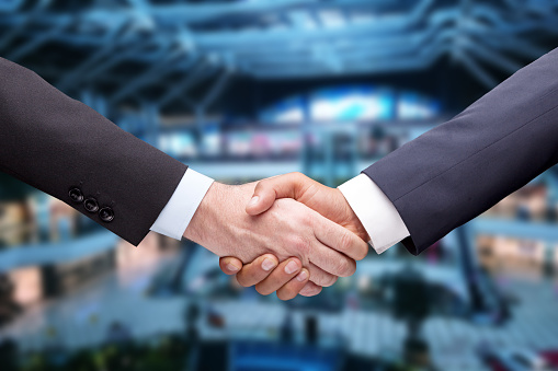 Handshake of businesspeople. Female and male hand makes a handshake in the office.partner to celebration partnership and business deal concept