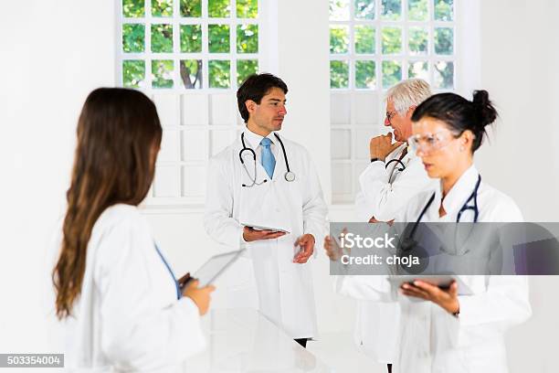 Team Of Doctors Working In Laboratory Stock Photo - Download Image Now - Biotechnology, Cardiologist, Computer