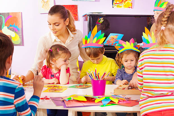 istock Teacher and group of kids in craft class 503354972