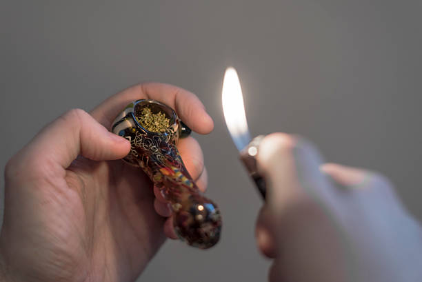 istock glass bowl with marijuana and lighter 503357754