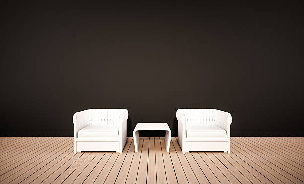 istock Oak wood floor and black wall, with white armchairs 503361342