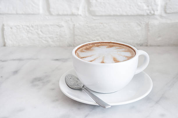 istock Hot Latte coffee and white wall 503361488